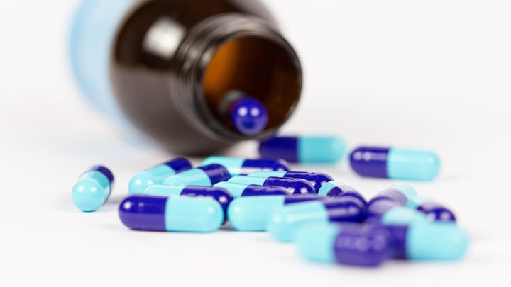 probiotics supplement bottle with capsules